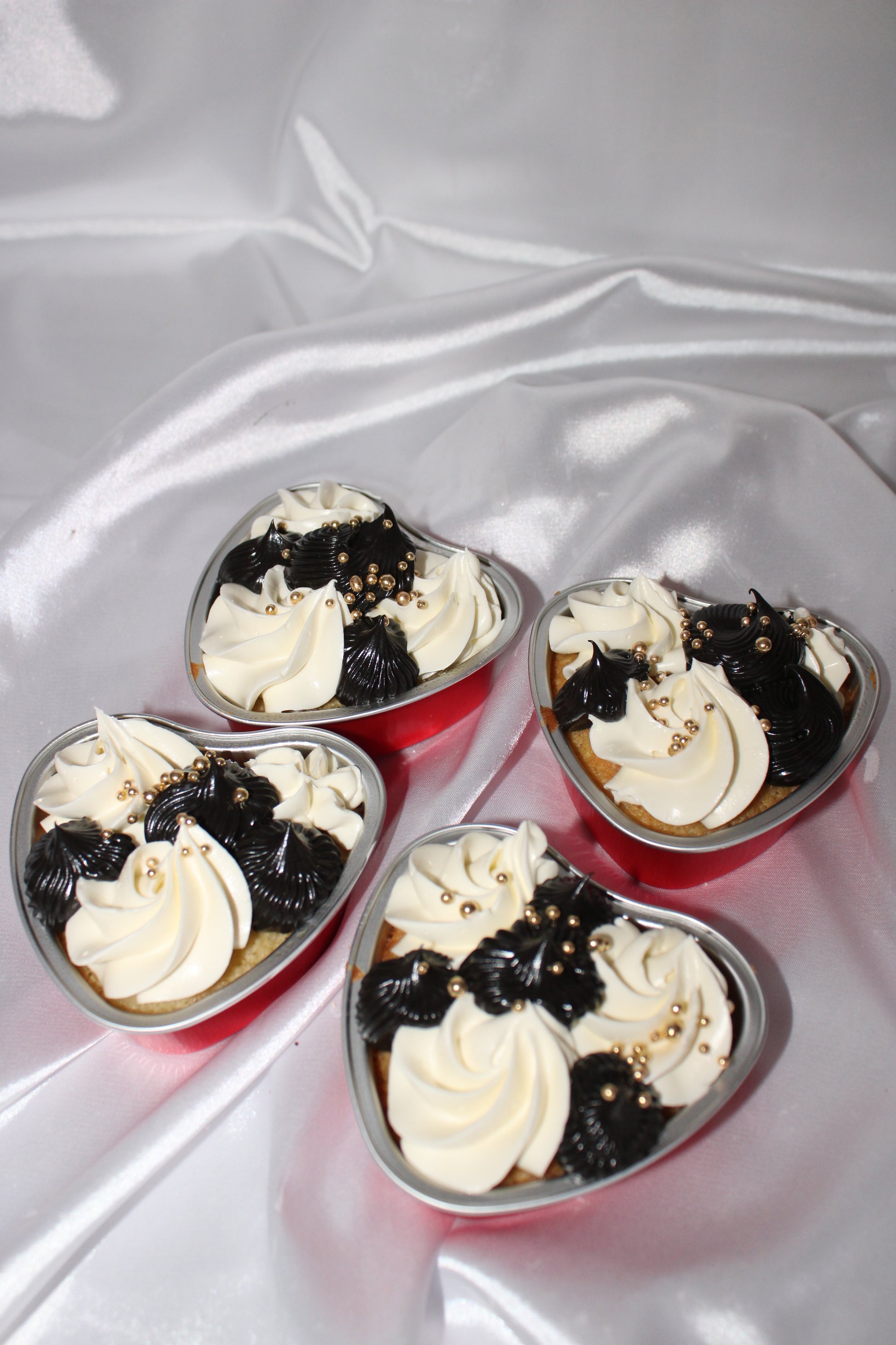 Personalised heart cake dessert in a single-serve container with decorative piping.