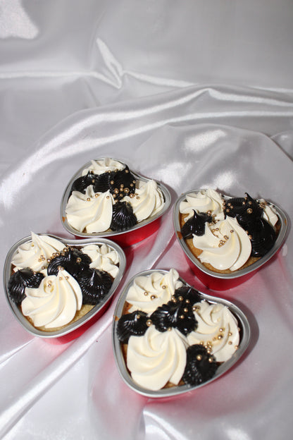 Personalised heart cake dessert in a single-serve container with decorative piping.