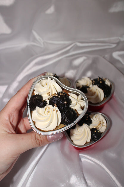 Customisable heart-shaped cake tub topped with smooth buttercream swirls and sugar pearls.