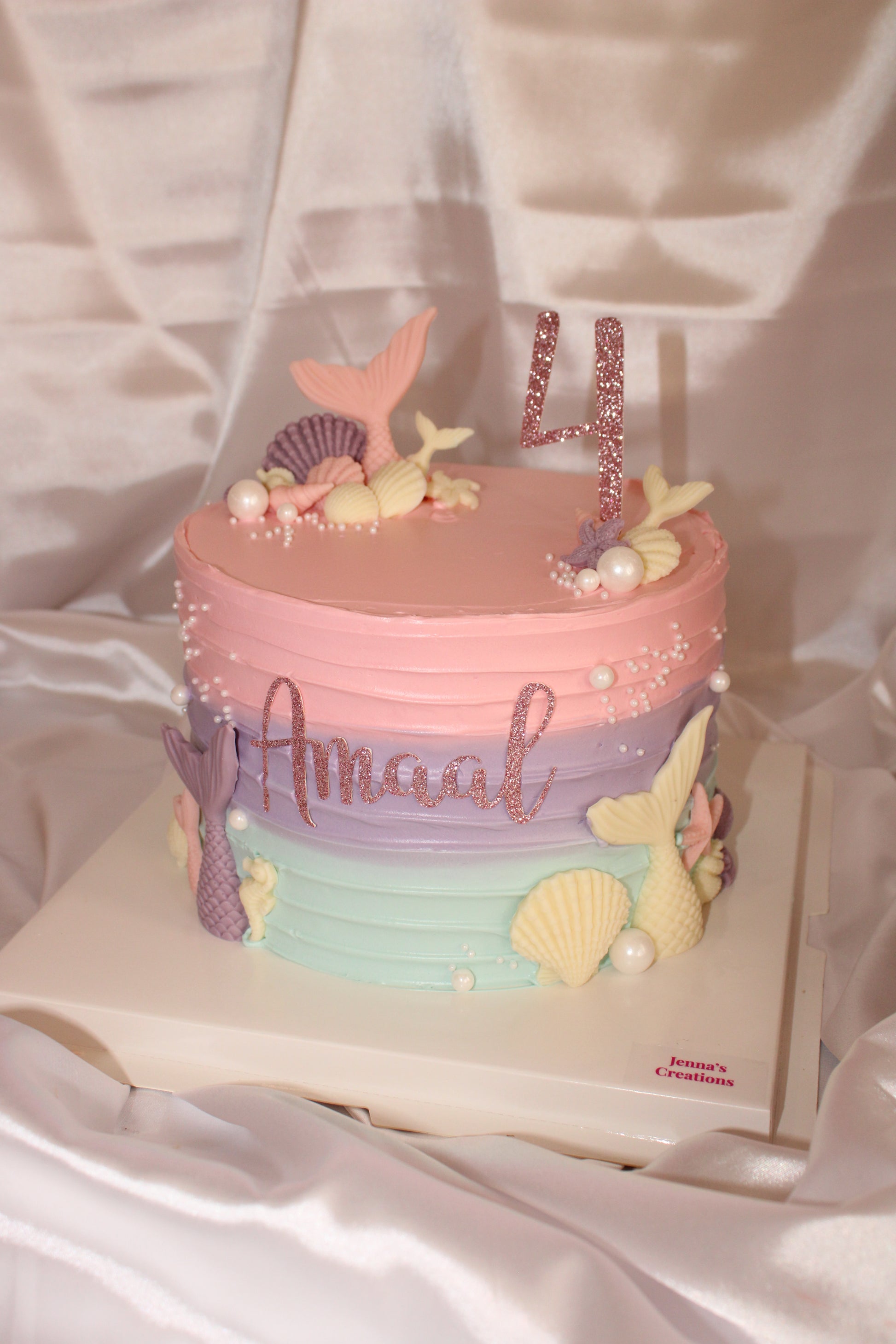 Under the sea themed mermaid cake in soft pink, lilac and mint buttercream