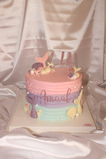 Pastel mermaid birthday cake with ombré buttercream, seashells, pearls and custom name topper
